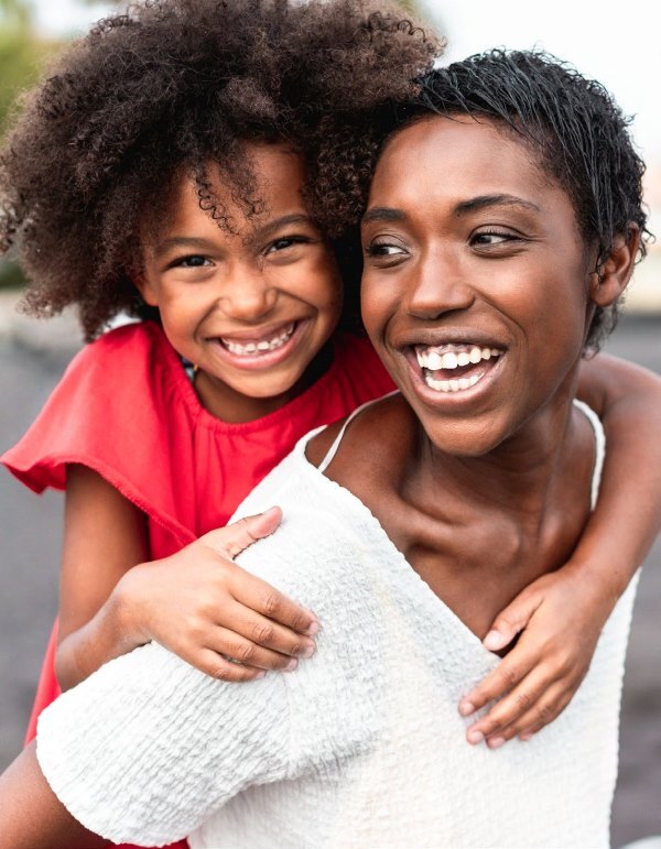 Woman holding a child.