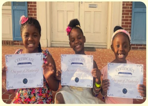 Three young ladies holding certificates.