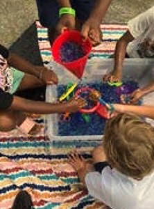 A group of children playing with toys.